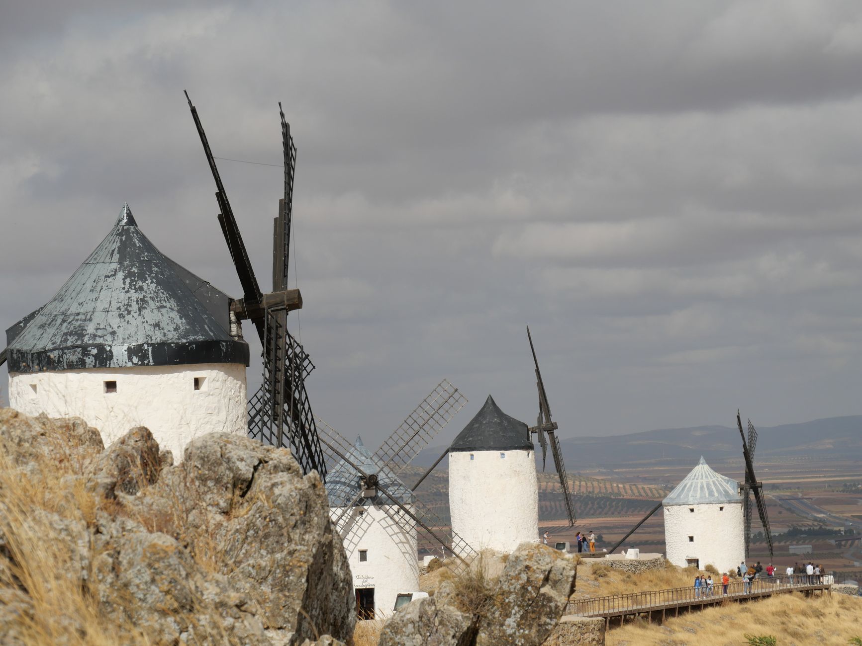 Scenic view of historic windmills in Consuegra, Spain, reflecting Don Quixote's era.