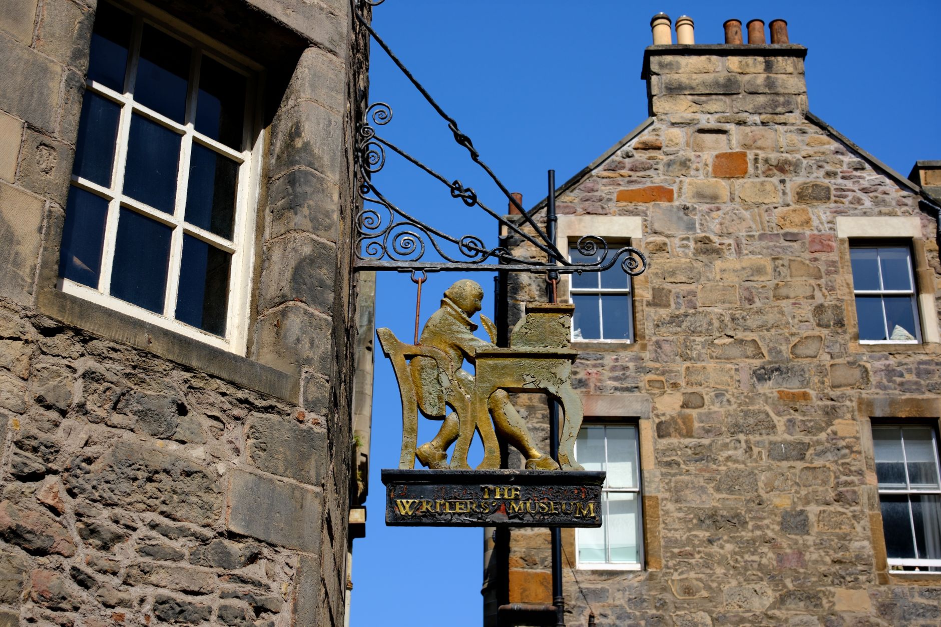 The Writers' Museum sign on a historic building in Edinburgh, Scotland.