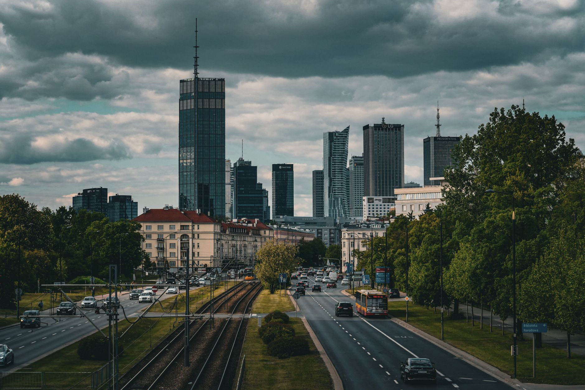 A captivating view of Warsaw's skyline with dramatic clouds, capturing urban architecture and city life.