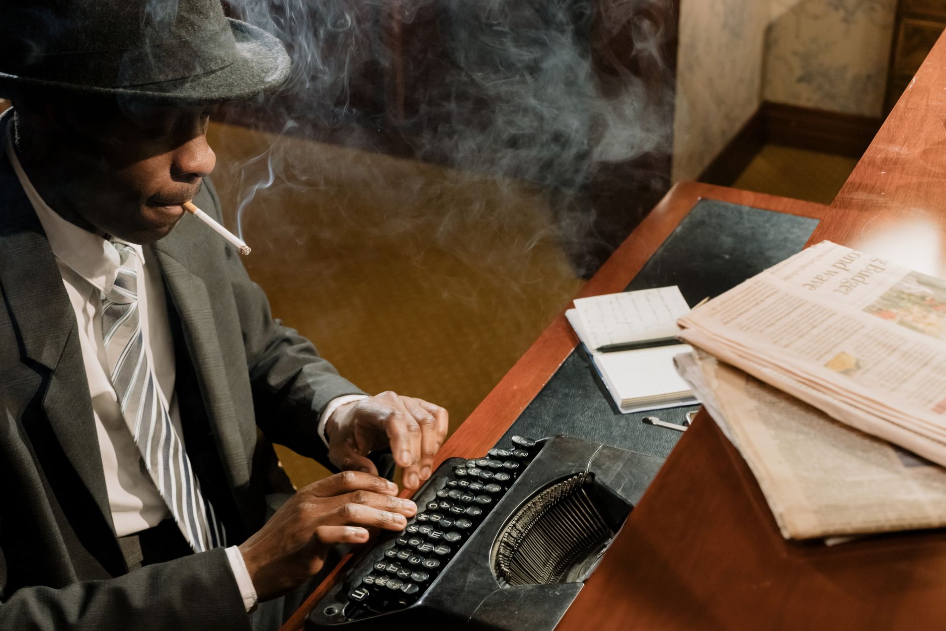 Retro cinematic scene of a detective typing on a vintage typewriter, surrounded by smoke and mystery.