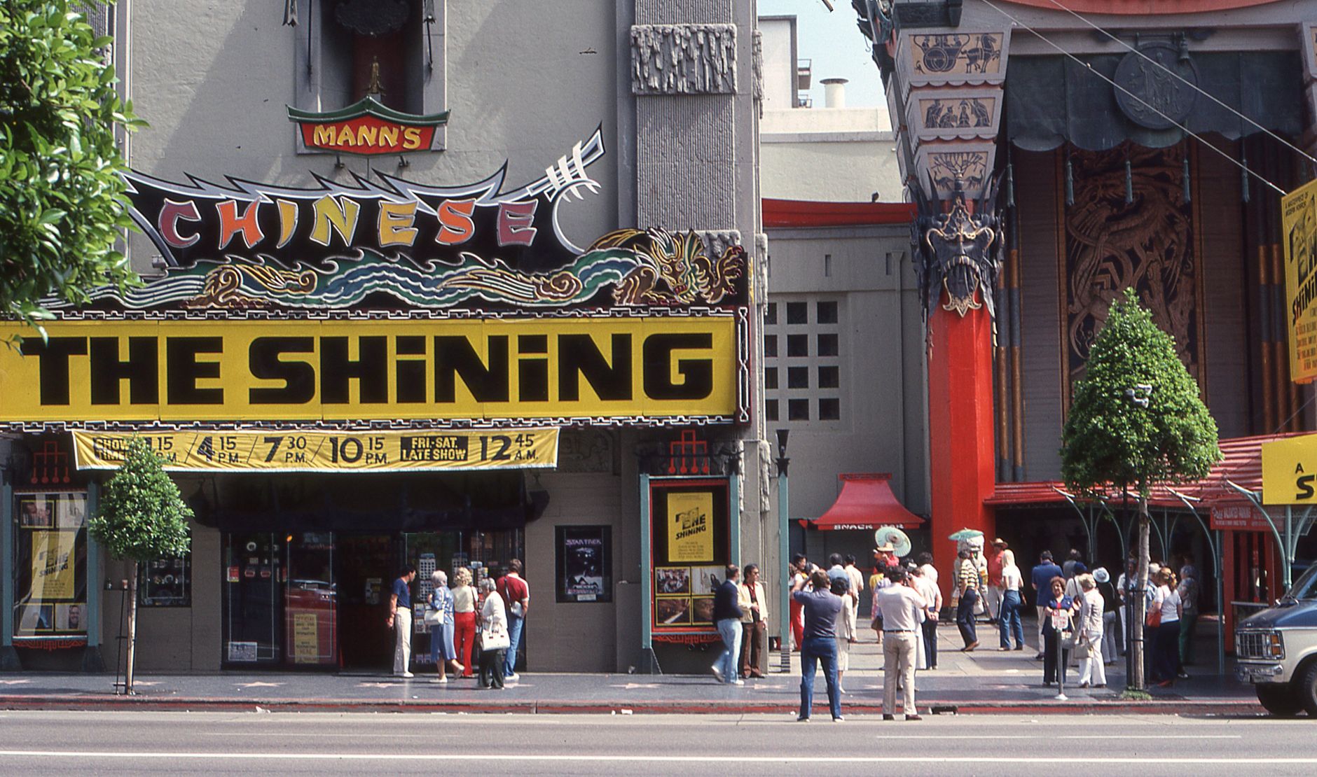 Iconic Chinese Theater in Hollywood with people, a classic urban snapshot from Los Angeles.